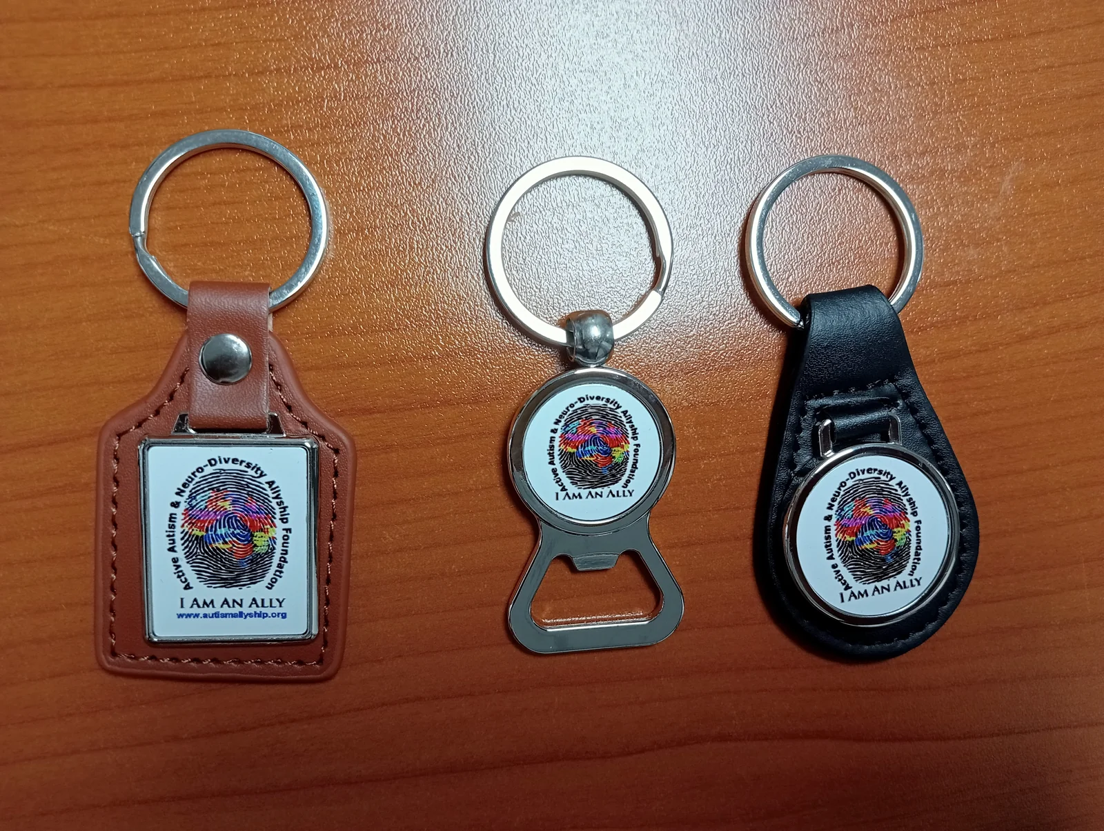 Autism Allyship keyrings in several designs